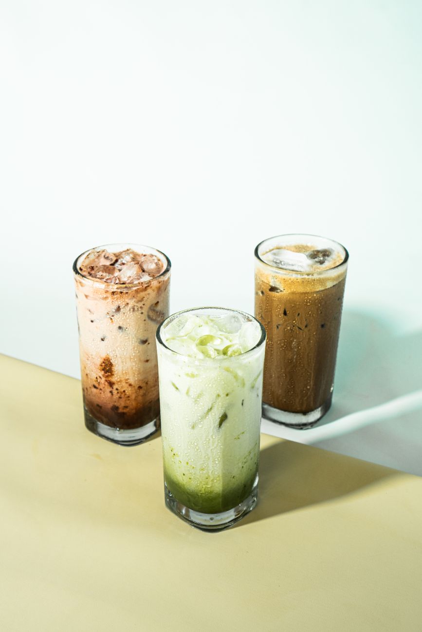 refreshing iced beverages trio on light background